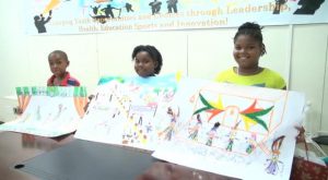 Winners of the Department of Youth and Sports, Youth in the Arts Competition Primary School category (l-r) Omar Wilkin of the Elizabeth Pemberton Primary School, Kaylan Williams and Micara Scarborough of the Charlestown Primary School during the prize giving ceremony at the Department’s conference room in Charlestown on July 28, 2015